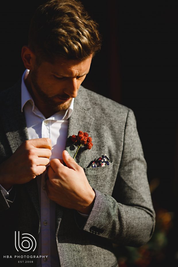 Gorgeous groom with bramble buttonhole